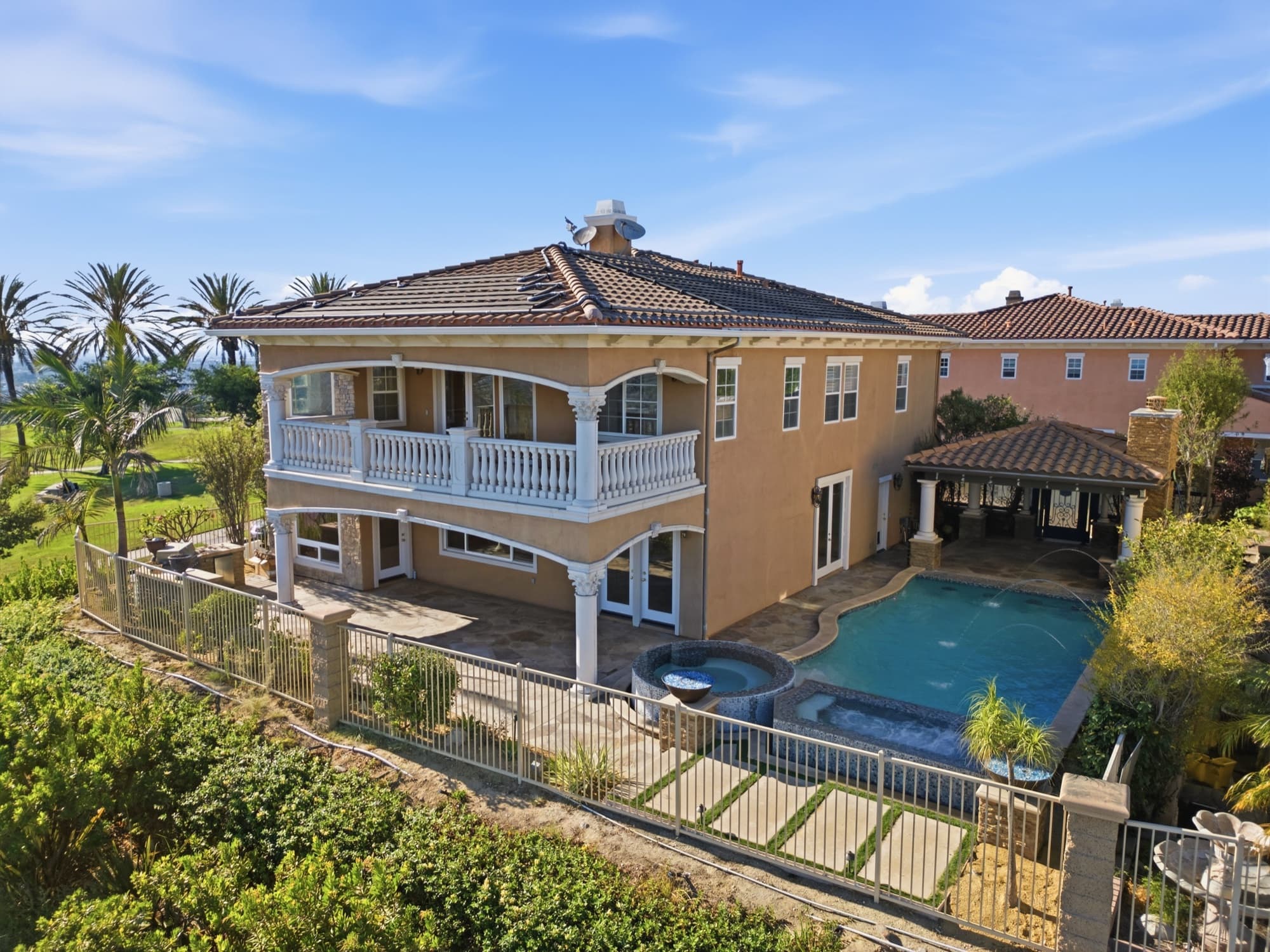 Aerial view of a home and pool