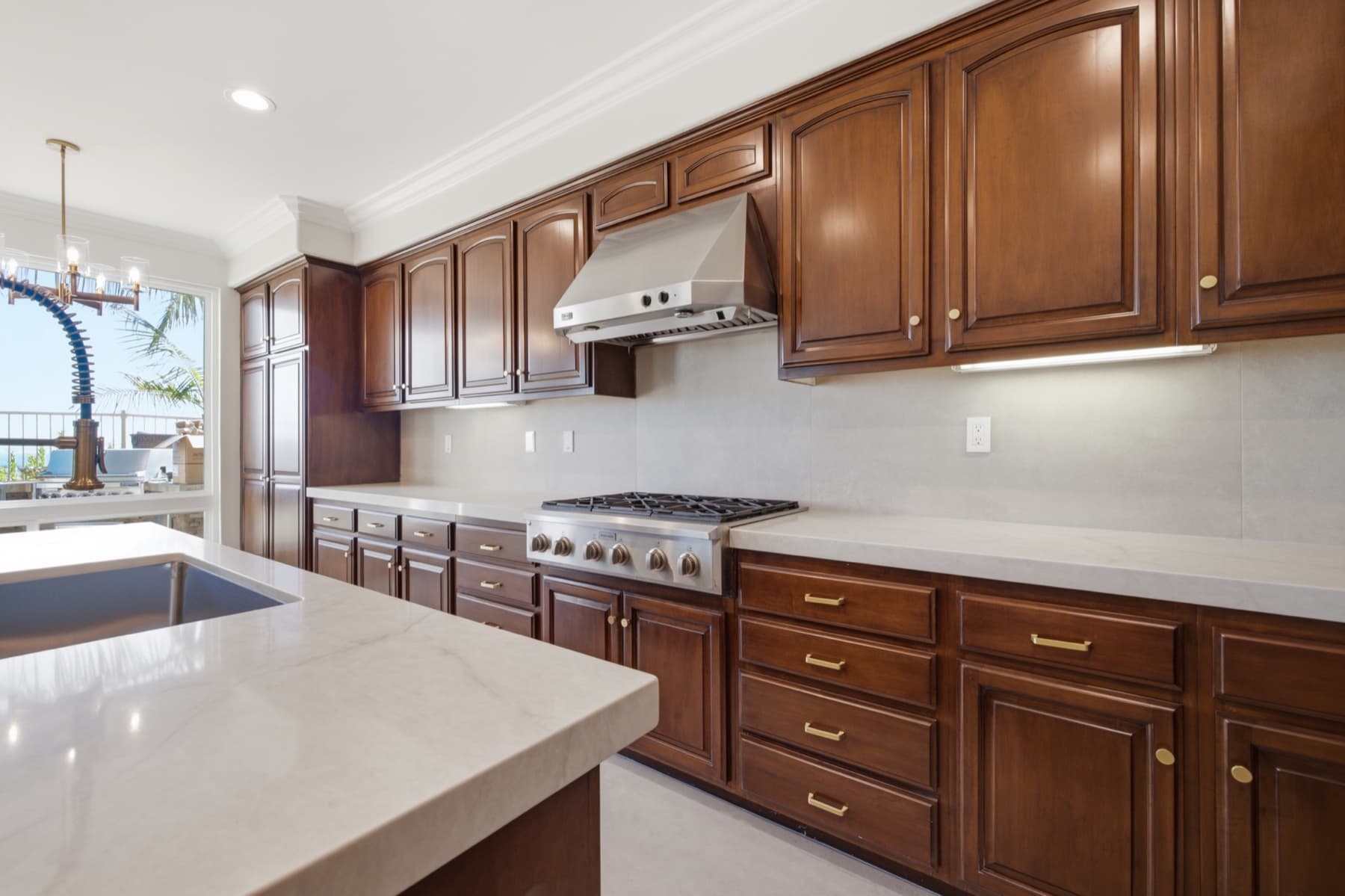Kitchen with wood cabinetry and a central island