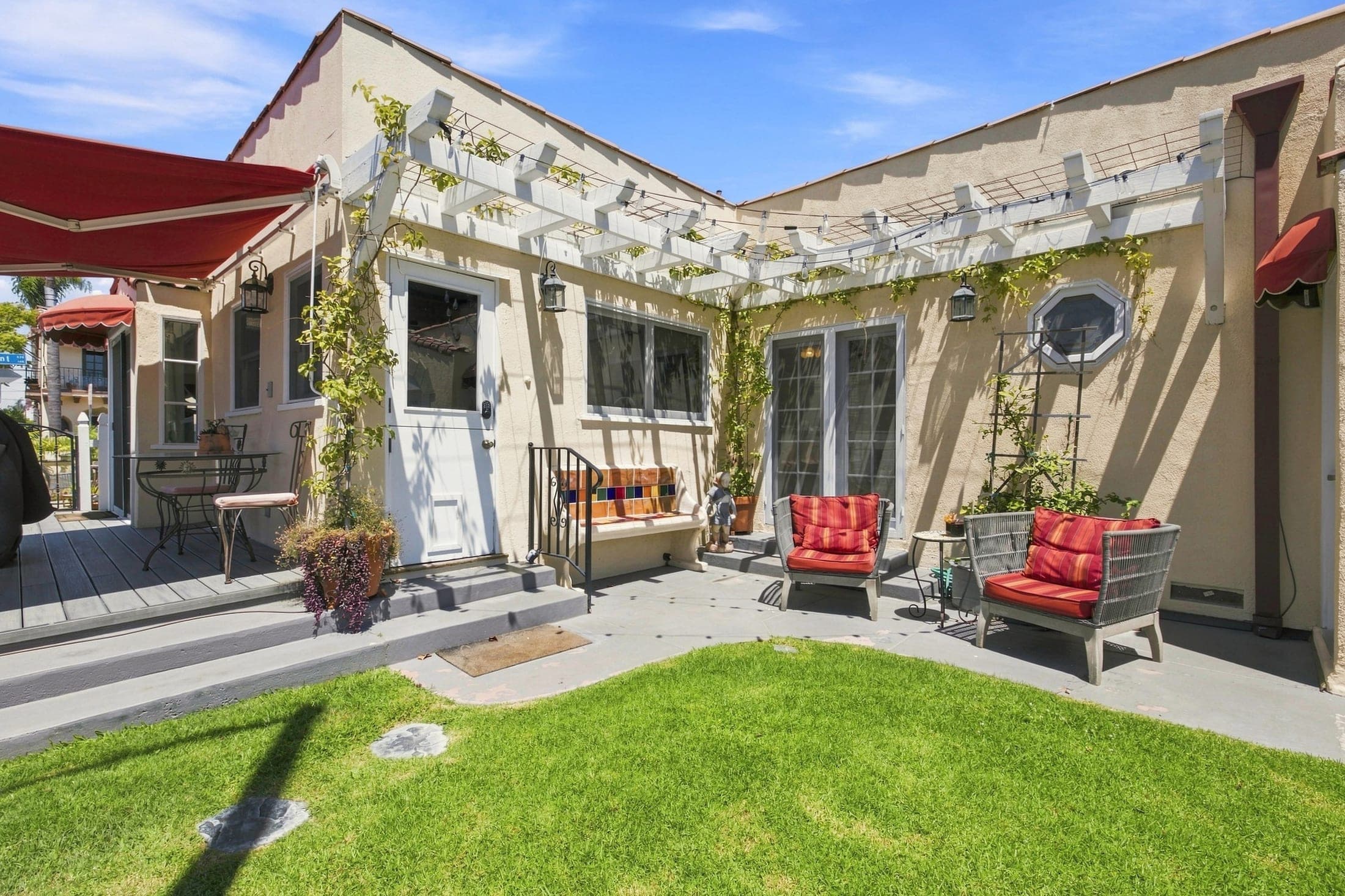 Private courtyard with lawn and outdoor seating