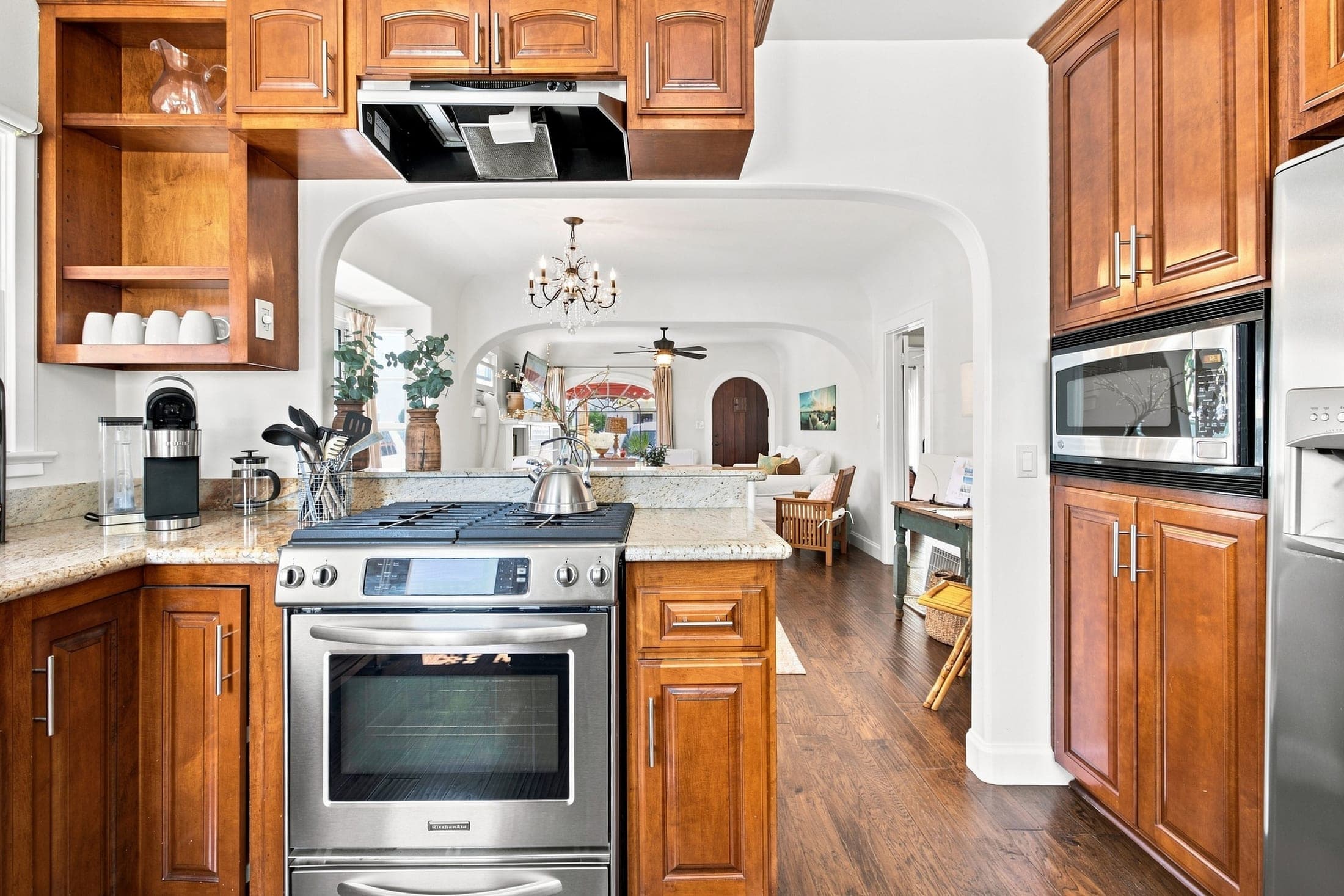 Vacation rental kitchen with wood cabinetry and stainless appliances